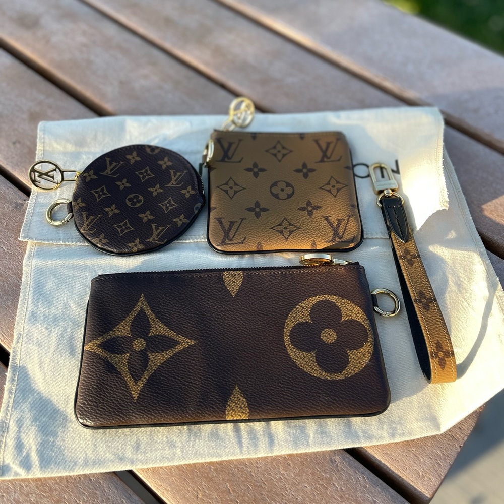 Authenticated Louis Vuitton Trio Pouch Set Reverse Brand new. Never used.